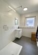 Sonnige Aussichten: Moderne Wohnung mit Südbalkon und Stellplatz im Zentrum Kornwestheims! - Modernes Badezimmer mit bodentiefer Dusche